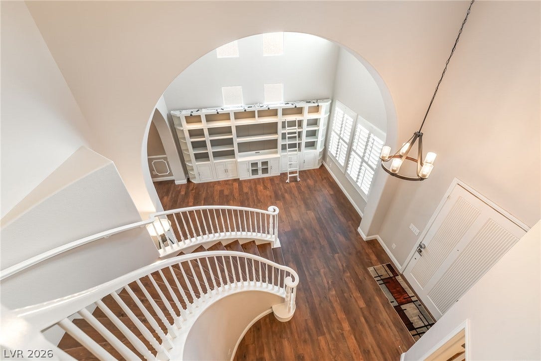 11416 Rancho Portena Avenue, Las Vegas, NV 89138 Rich hardwood floors and a striking arched opening define this airy, light-filled entryway.