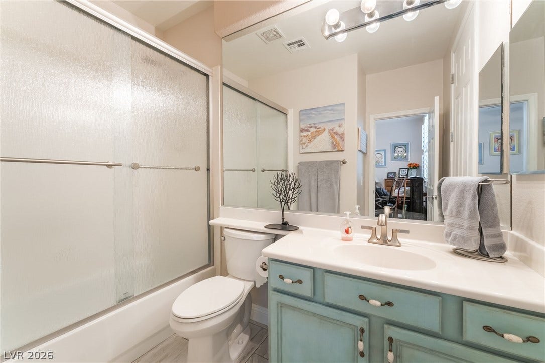 11416 Rancho Portena Avenue, Las Vegas, NV 89138 Functional layout pairs a classic vanity with a glass-enclosed tub shower.