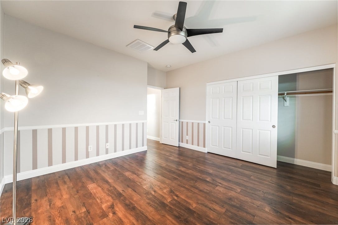 11416 Rancho Portena Avenue, Las Vegas, NV 89138 Rich hardwood flooring pairs with classic wainscoting details in this well-appointed space.