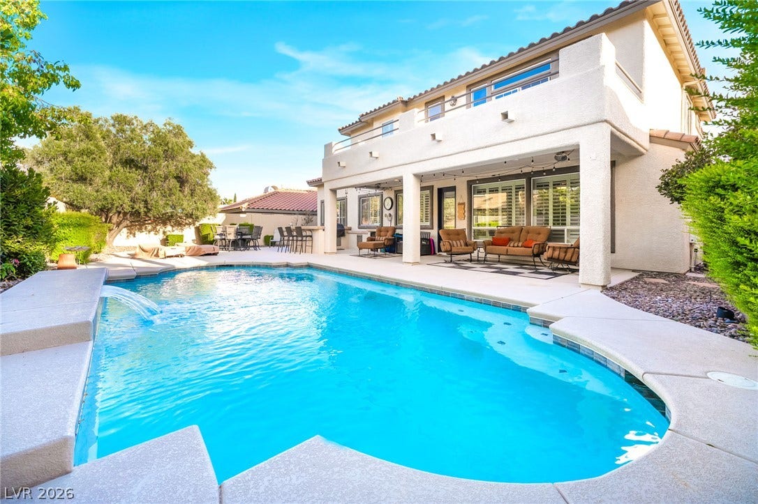 11416 Rancho Portena Avenue, Las Vegas, NV 89138 A sparkling in-ground pool anchors the backyard of this two-story stucco home.