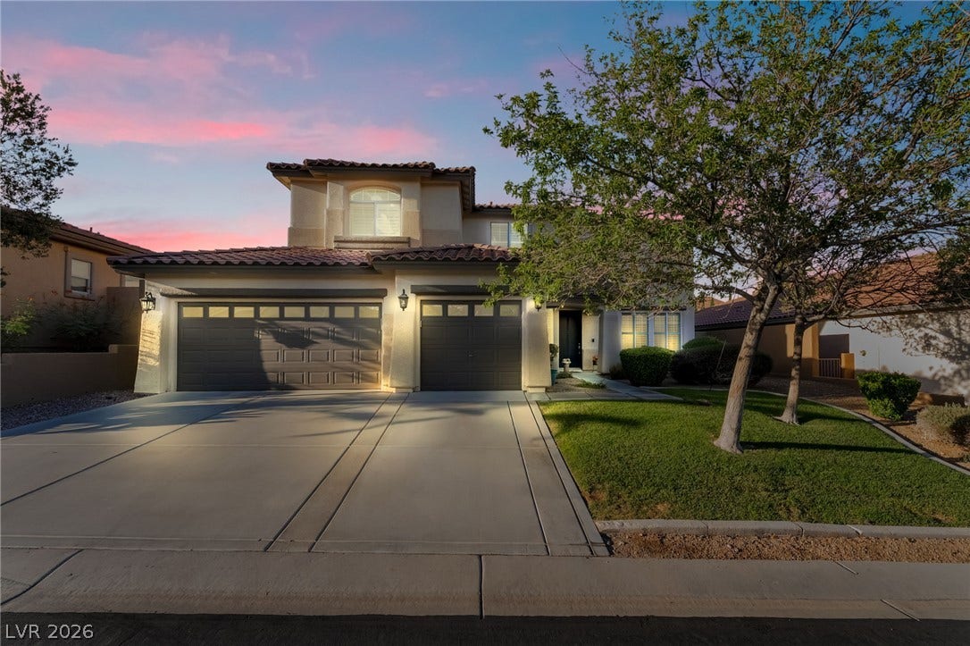 11416 Rancho Portena Avenue, Las Vegas, NV 89138 Spanish tile rooflines and a spacious driveway define this striking two-story exterior facade.