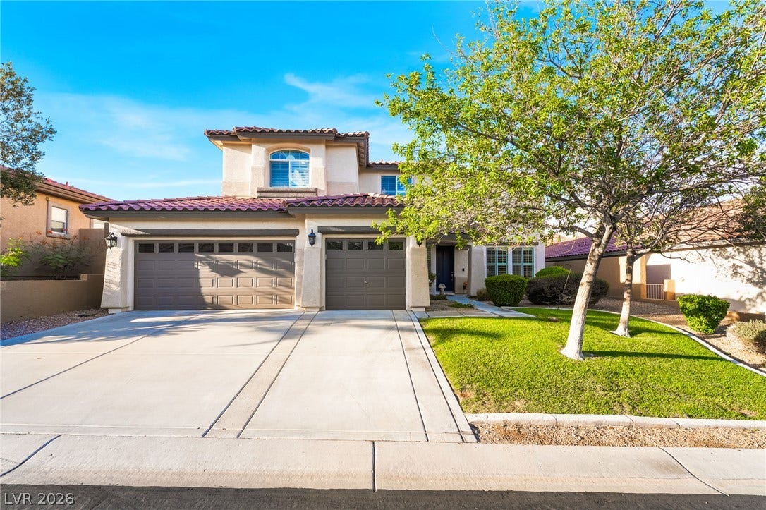 11416 Rancho Portena Avenue, Las Vegas, NV 89138 A spacious driveway and neat landscaping frame this two-story stucco residence with a Spanish tile roof.