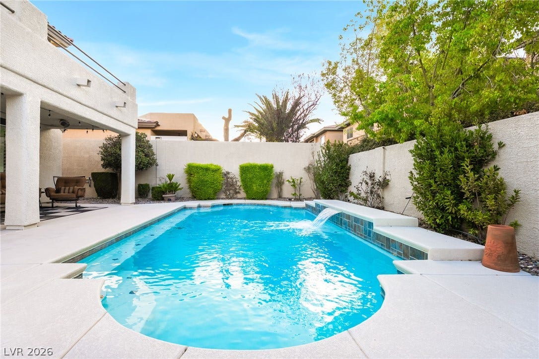 11416 Rancho Portena Avenue, Las Vegas, NV 89138 A sparkling swimming pool anchors this private backyard setting surrounded by high privacy walls.
