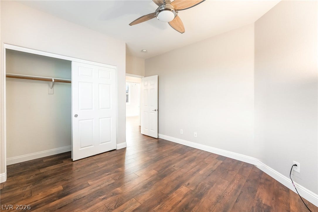 11416 Rancho Portena Avenue, Las Vegas, NV 89138 Rich wood-look flooring and a built-in closet define this versatile room.