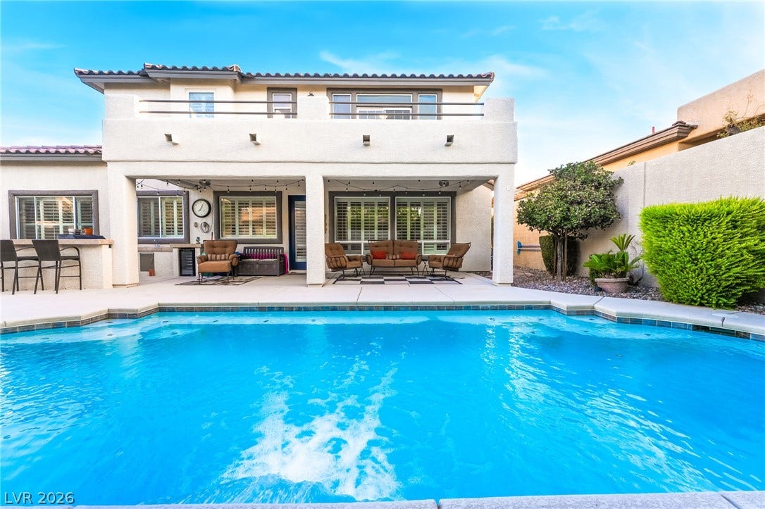 11416 Rancho Portena Avenue, Las Vegas, NV 89138 An inviting backyard oasis centers around a sparkling swimming pool below the shaded covered patio.