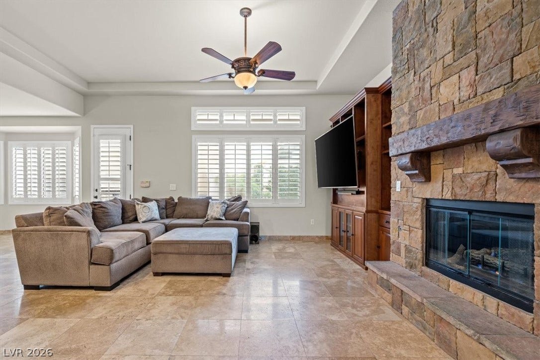 11388 Orazio Drive, Las Vegas, NV 89138 Built-in entertainment unit and fireplace in living room.