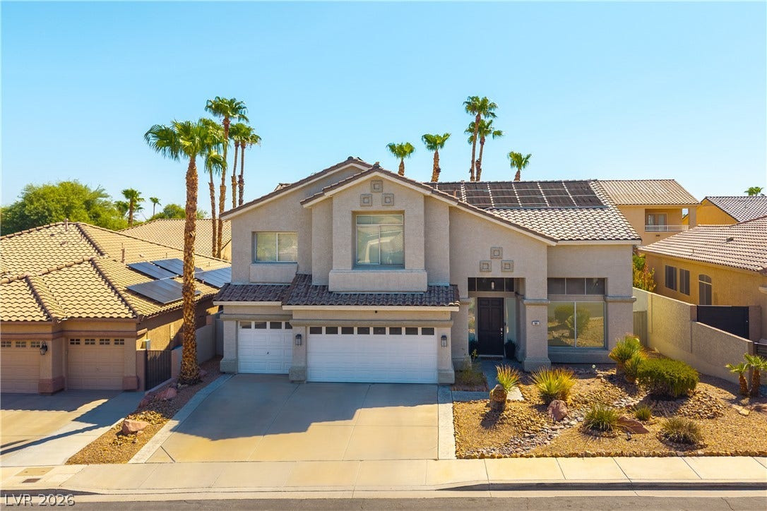 94 Shepherd Mesa Court, Henderson, NV 89074 Desert landscaping and a tiled roof define the exterior of this two-story stucco home.
