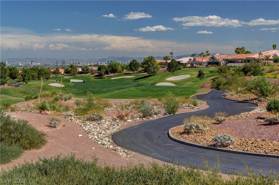 2621 Hanging Rock Drive, Las Vegas, NV 89134 Lush fairways border this property, offering beautiful green views extending toward the city skyline.
