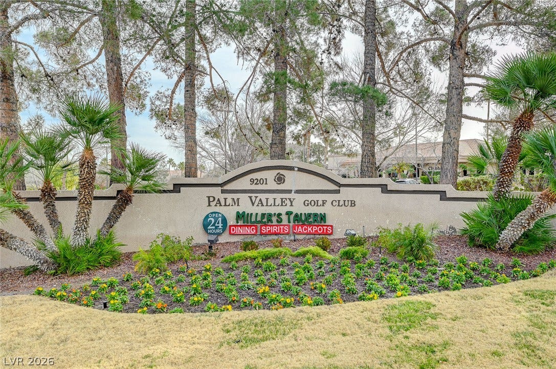 2621 Hanging Rock Drive, Las Vegas, NV 89134 Mature trees frame the stone monument sign welcoming residents to the golf club community.