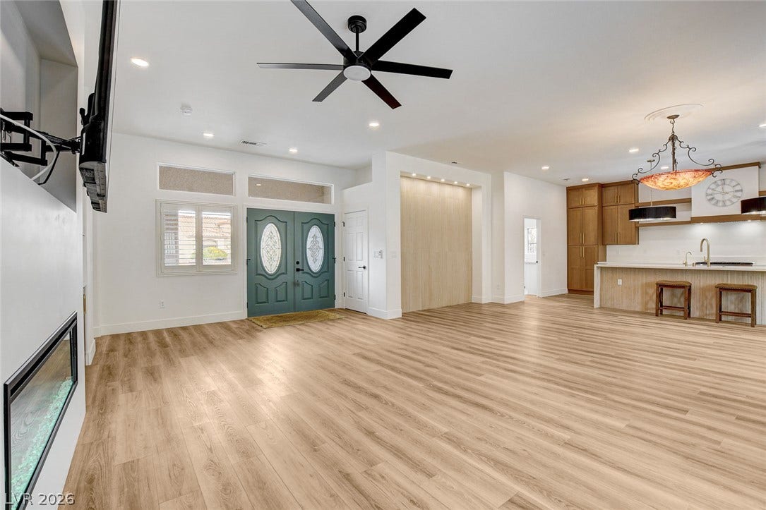 2621 Hanging Rock Drive, Las Vegas, NV 89134 An open floorplan seamlessly connects the airy living area to a modern kitchen.