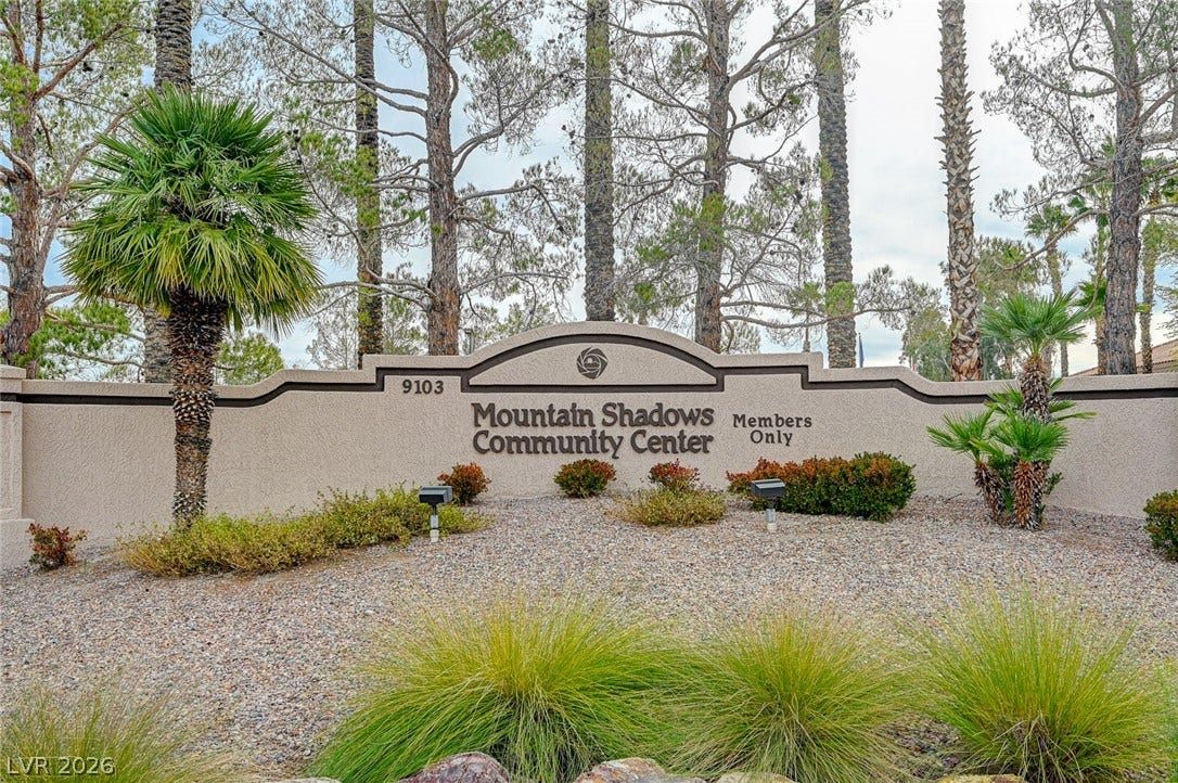 2621 Hanging Rock Drive, Las Vegas, NV 89134 Mature trees and landscaping frame the entry sign welcoming residents to the community center.