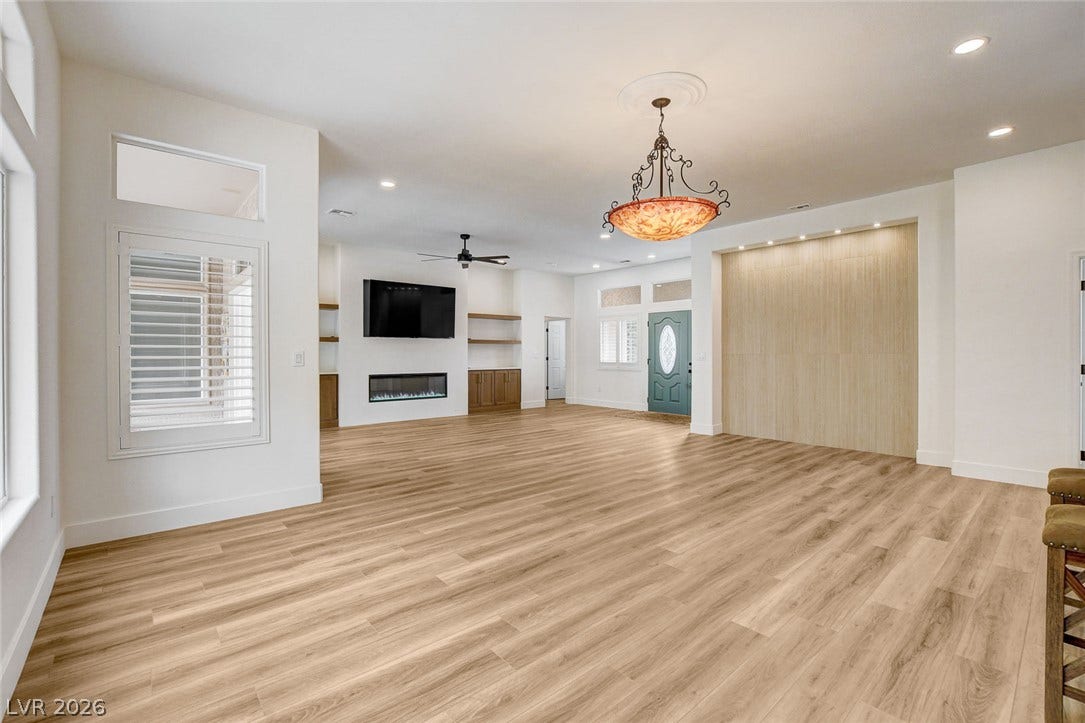 2621 Hanging Rock Drive, Las Vegas, NV 89134 Clean lines and warm wood floors define this welcoming, light-filled open concept living area.
