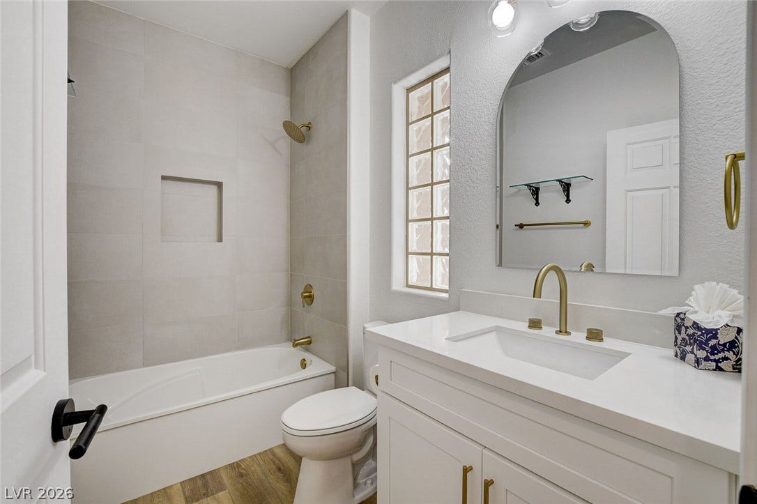 2621 Hanging Rock Drive, Las Vegas, NV 89134 Modern finishes and a clean vanity design define this updated bathroom space.