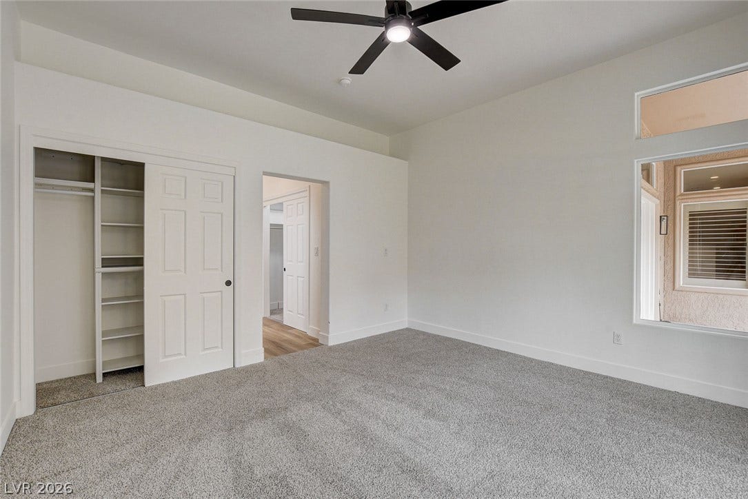 2621 Hanging Rock Drive, Las Vegas, NV 89134 High ceilings and soft carpeting create a serene and airy atmosphere in this bedroom.