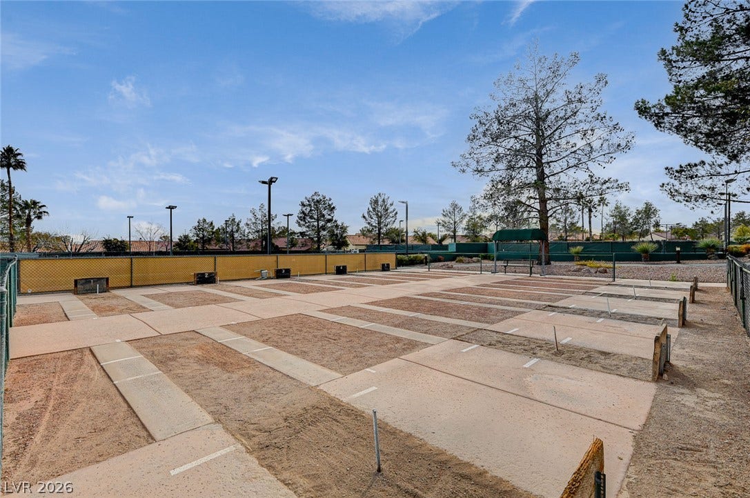 2621 Hanging Rock Drive, Las Vegas, NV 89134 Dedicated outdoor recreation courts are situated under open blue skies surrounded by mature trees.