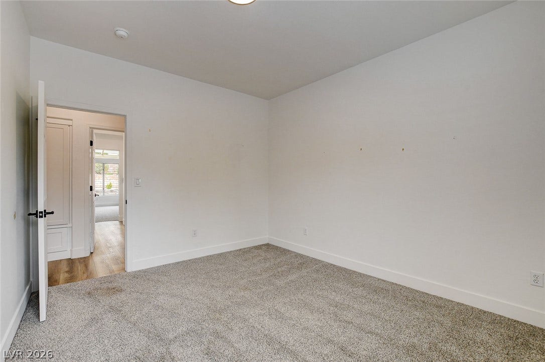 2621 Hanging Rock Drive, Las Vegas, NV 89134 Plush wall-to-wall carpeting and neutral walls define this versatile interior space.