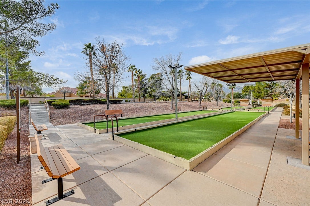 2621 Hanging Rock Drive, Las Vegas, NV 89134 A shaded pavilion overlooks meticulously maintained outdoor bocce ball courts under clear blue skies.