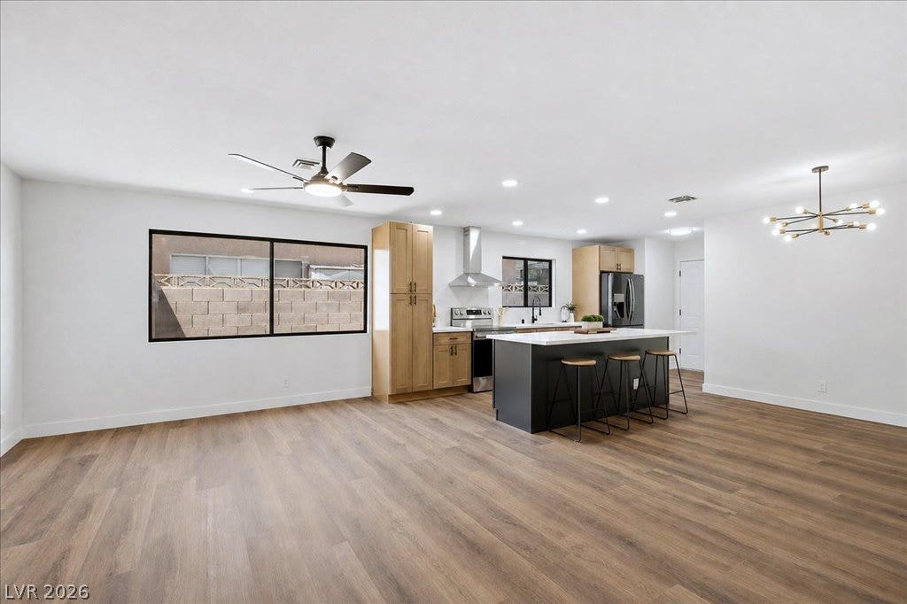 3912 Casa Grande Avenue, Las Vegas, NV 89102 An open floorplan seamlessly connects the airy living area to a modern kitchen space.