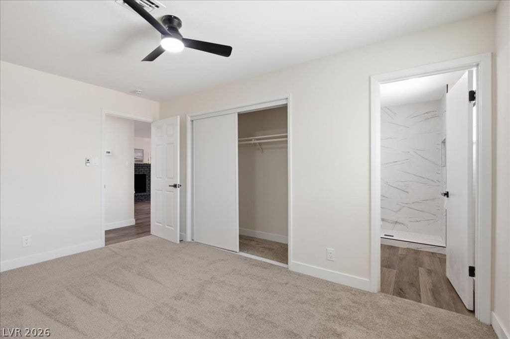 3912 Casa Grande Avenue, Las Vegas, NV 89102 A spacious bedroom offers plush neutral carpeting and convenient direct access to an adjoining bathroom.