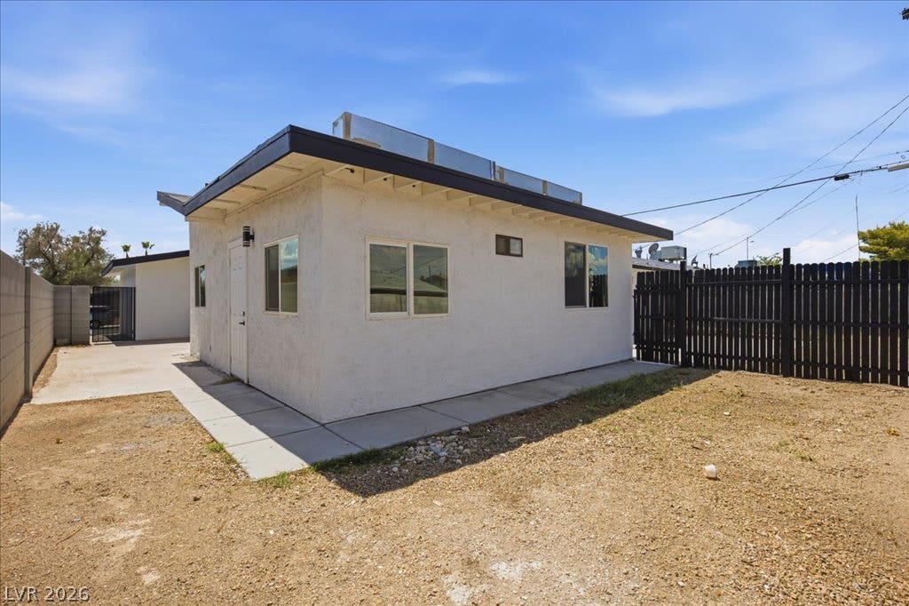 3912 Casa Grande Avenue, Las Vegas, NV 89102 A detached auxiliary structure sits alongside a fenced yard area under blue skies.