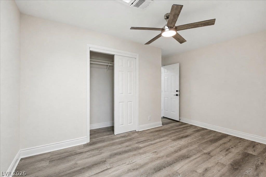 3912 Casa Grande Avenue, Las Vegas, NV 89102 Smooth wood-look flooring and crisp trim define this versatile auxiliary bedroom space.