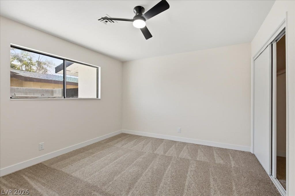 3912 Casa Grande Avenue, Las Vegas, NV 89102 Plush carpeting and a wide window define this comfortable bedroom space.