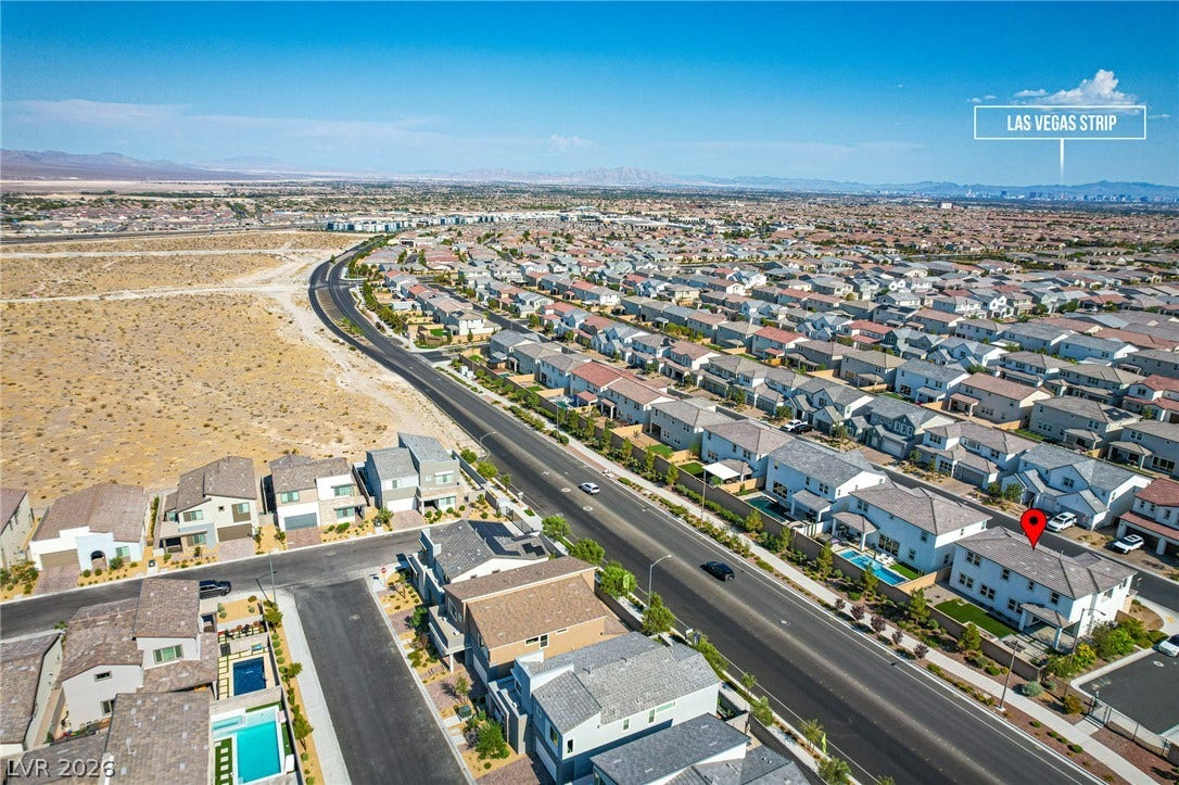 10226 Pleasant Knoll Avenue, Las Vegas, NV 89166 Distant skyline views highlight this elevated neighborhood panorama showing the surrounding desert landscape.