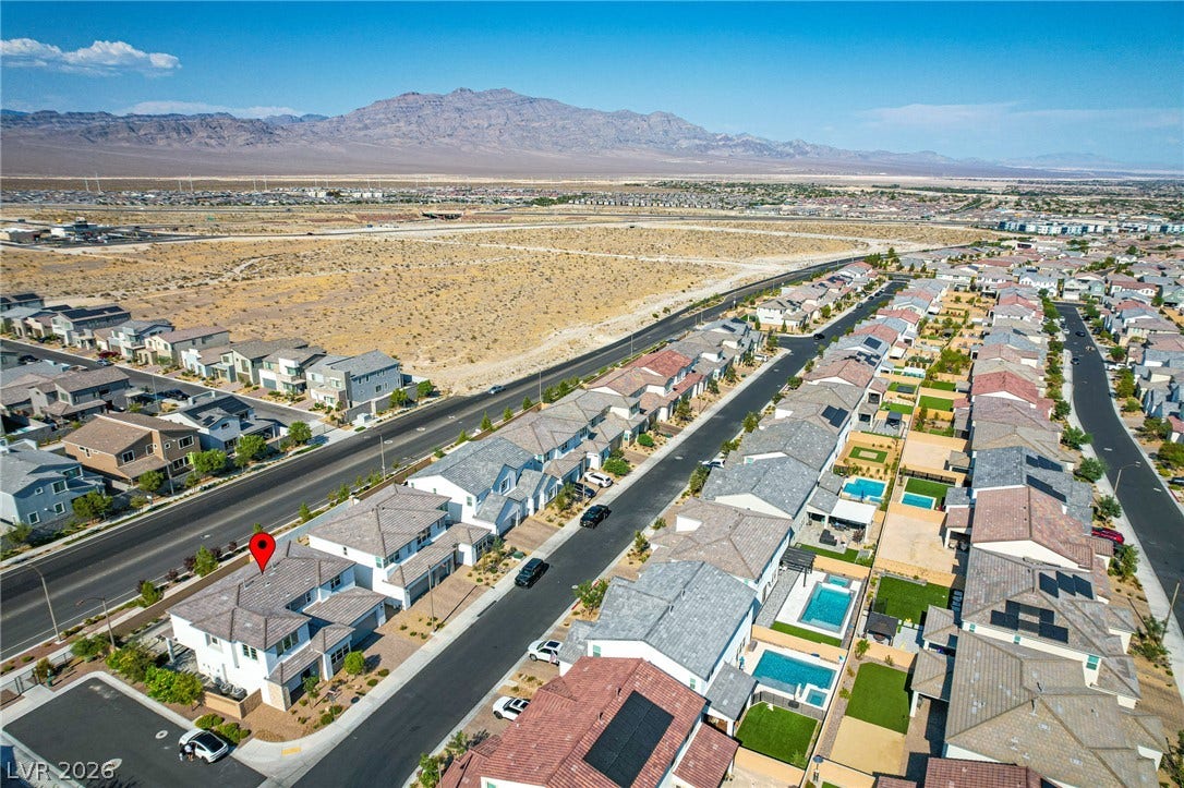 10226 Pleasant Knoll Avenue, Las Vegas, NV 89166 Dramatic mountain vistas frame this residential neighborhood.
