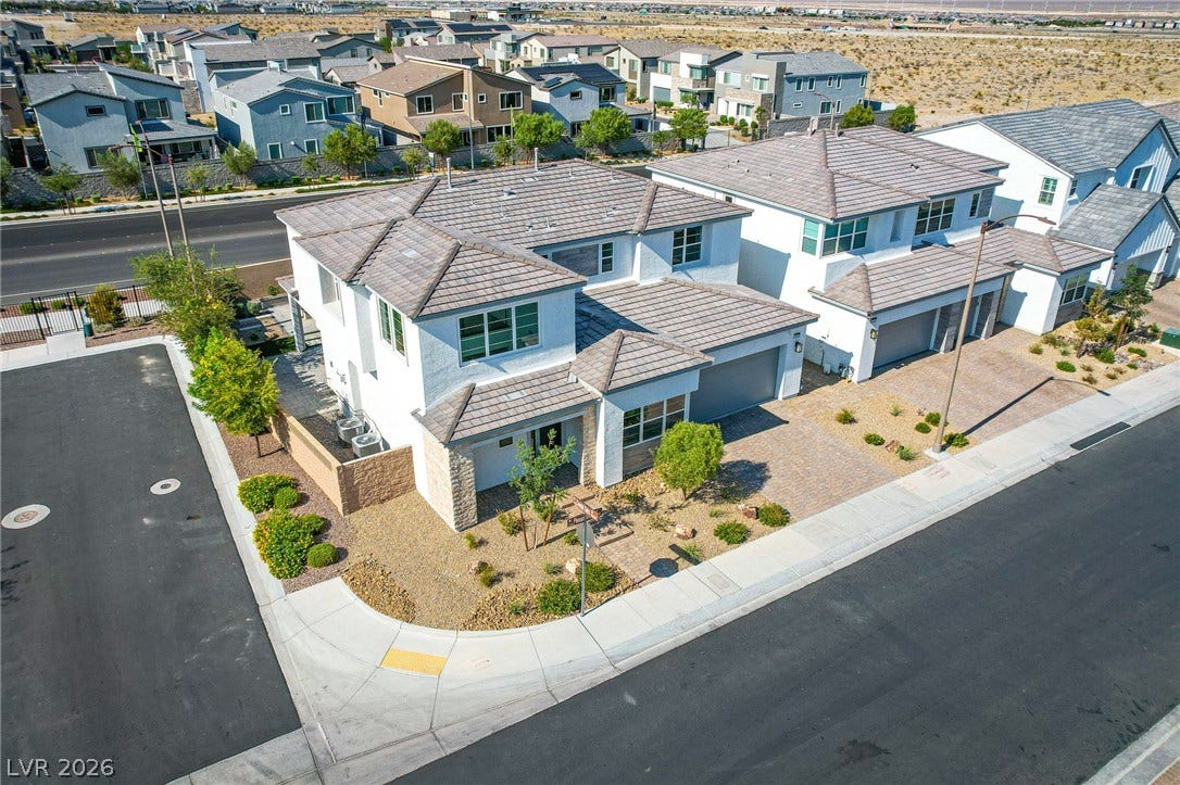 10226 Pleasant Knoll Avenue, Las Vegas, NV 89166 Clean lines and a modern tile roof define this amazing corner-lot exterior.