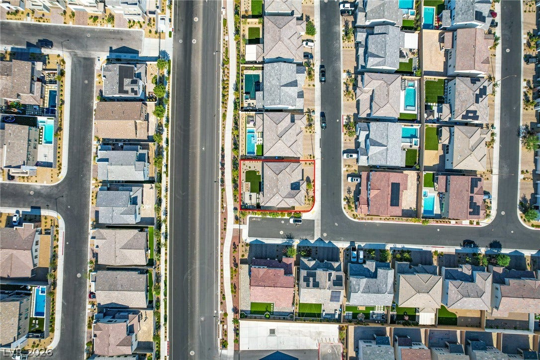 10226 Pleasant Knoll Avenue, Las Vegas, NV 89166 An aerial perspective reveals the organized layout of this modern residential neighborhood.