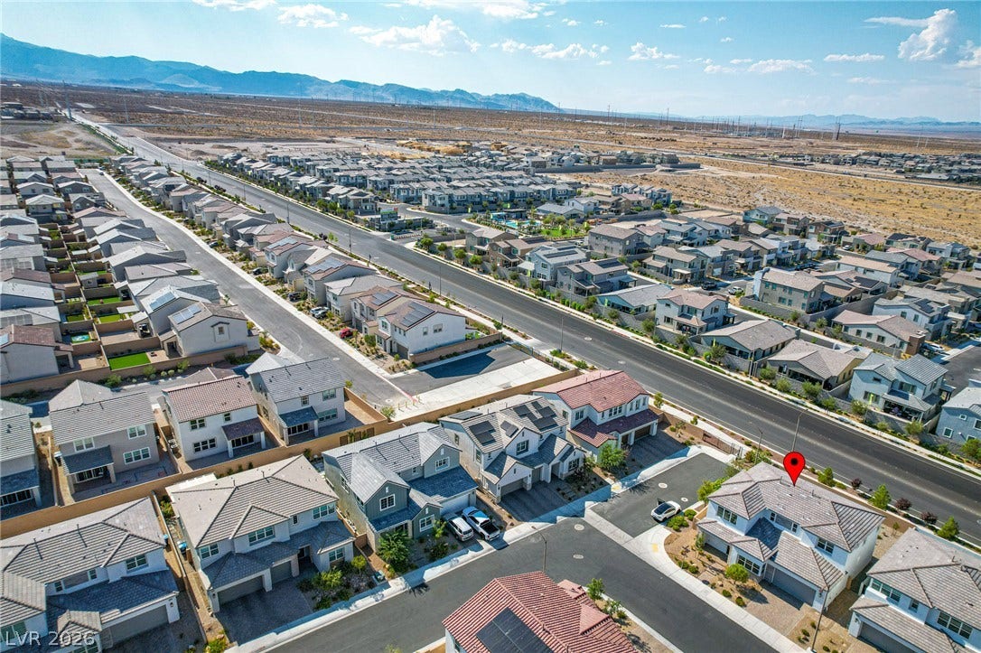10226 Pleasant Knoll Avenue, Las Vegas, NV 89166 Distant mountains frame this modern residential neighborhood.
