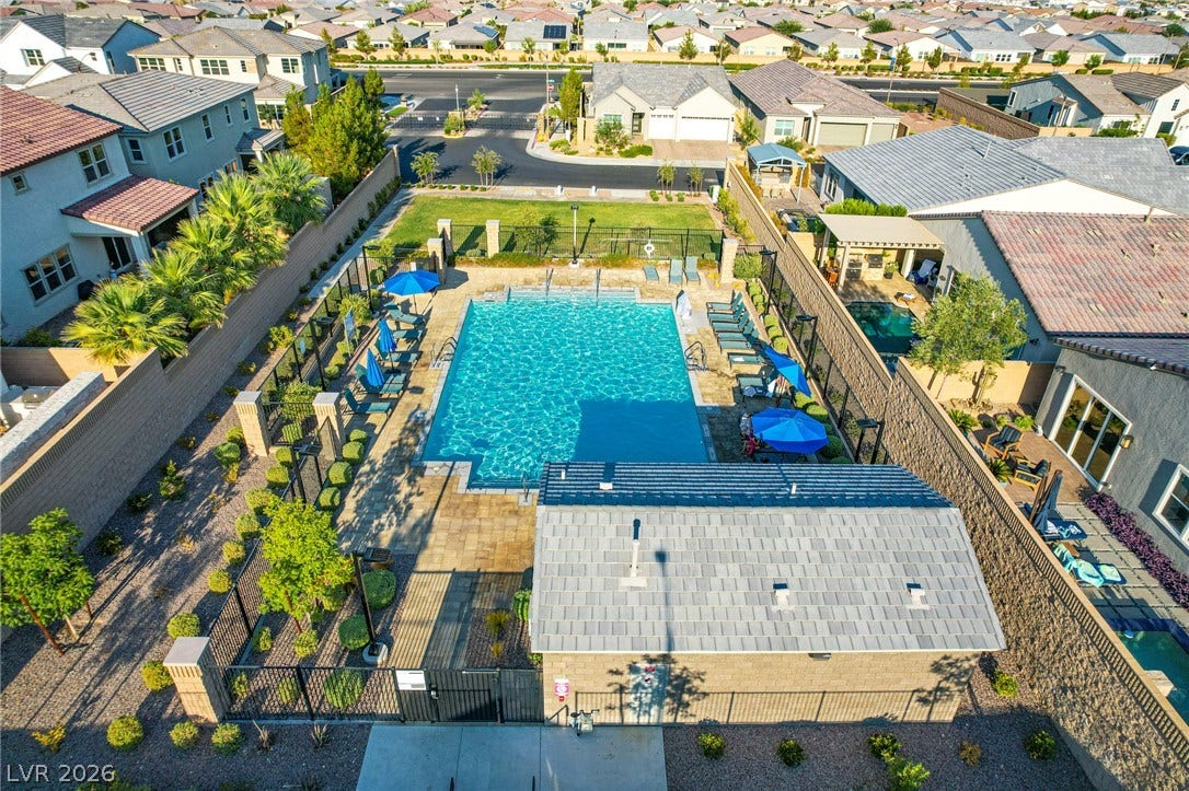 10226 Pleasant Knoll Avenue, Las Vegas, NV 89166 An aerial perspective showcases a sparkling community pool framed by meticulous landscaping.