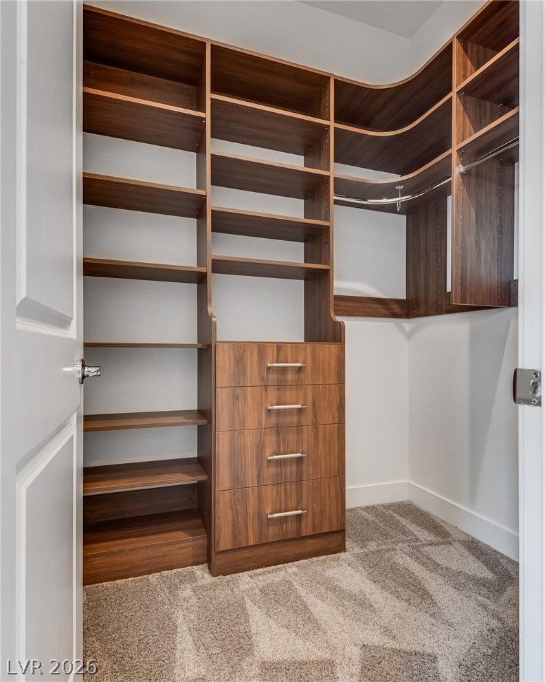 10226 Pleasant Knoll Avenue, Las Vegas, NV 89166 Walk-in closet with custom organizer in the downstairs bedroom.