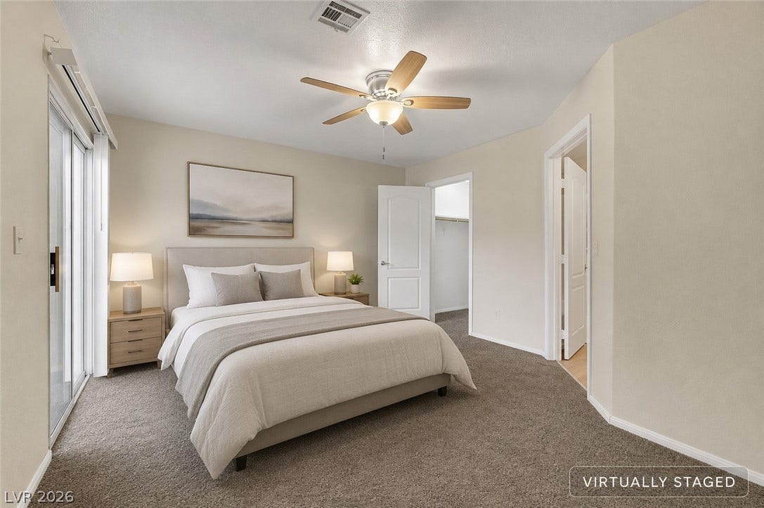 657 Anne Lane, #657, Henderson, NV 89015 Sliding glass doors open to the outdoors from this plushly carpeted bedroom retreat.