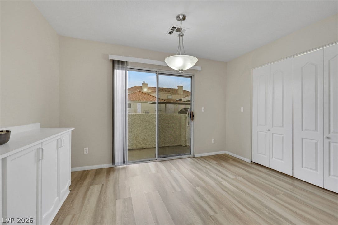 657 Anne Lane, #657, Henderson, NV 89015 Sliding glass doors open to a private patio from this versatile dining area.