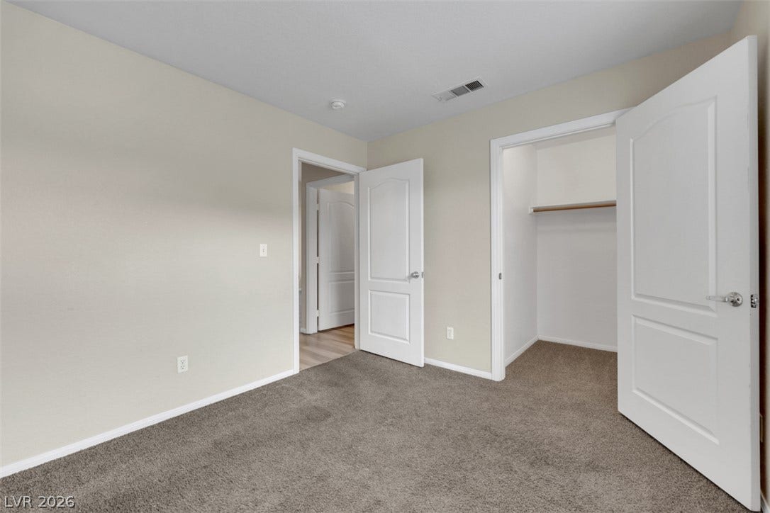 657 Anne Lane, #657, Henderson, NV 89015 Plush carpeting and a spacious closet define this comfortable secondary bedroom.