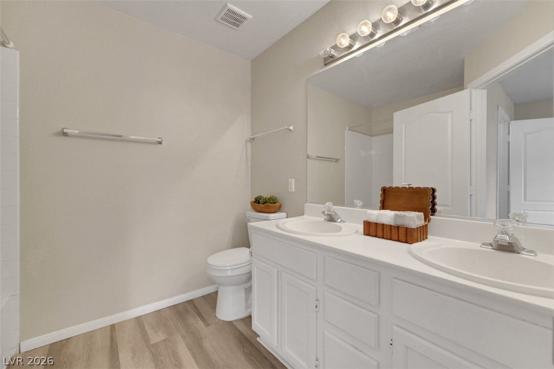 657 Anne Lane, #657, Henderson, NV 89015 A clean vanity with dual sinks anchors this well-appointed bathroom space.