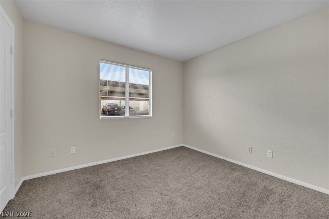 657 Anne Lane, #657, Henderson, NV 89015 Plush wall-to-wall carpeting and clean architectural lines define this versatile auxiliary bedroom.