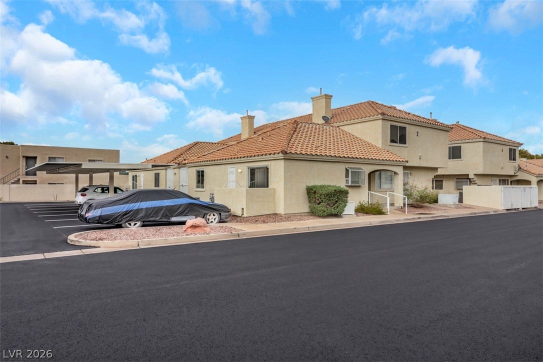 657 Anne Lane, #657, Henderson, NV 89015 Spanish tile roofing and stucco siding bring classic southwestern character to this multi-unit property exterior.