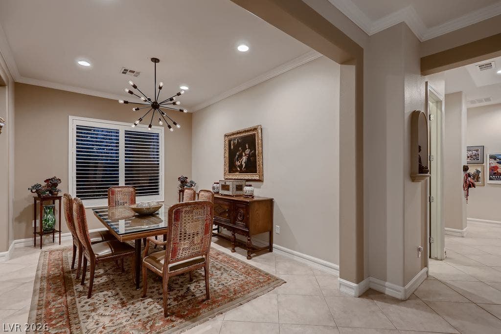 2284 Savannah River Street, Henderson, NV 89044 Elegant crown molding and classic tile flooring define this formal dining space.