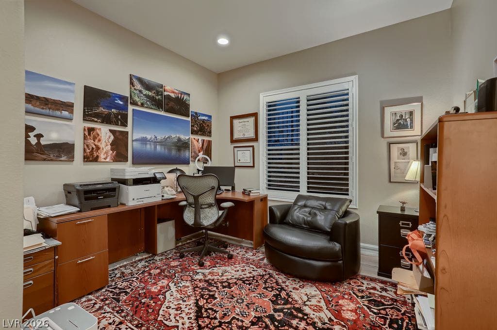 2284 Savannah River Street, Henderson, NV 89044 A quiet home office features a wide window fitted with plantation shutters.