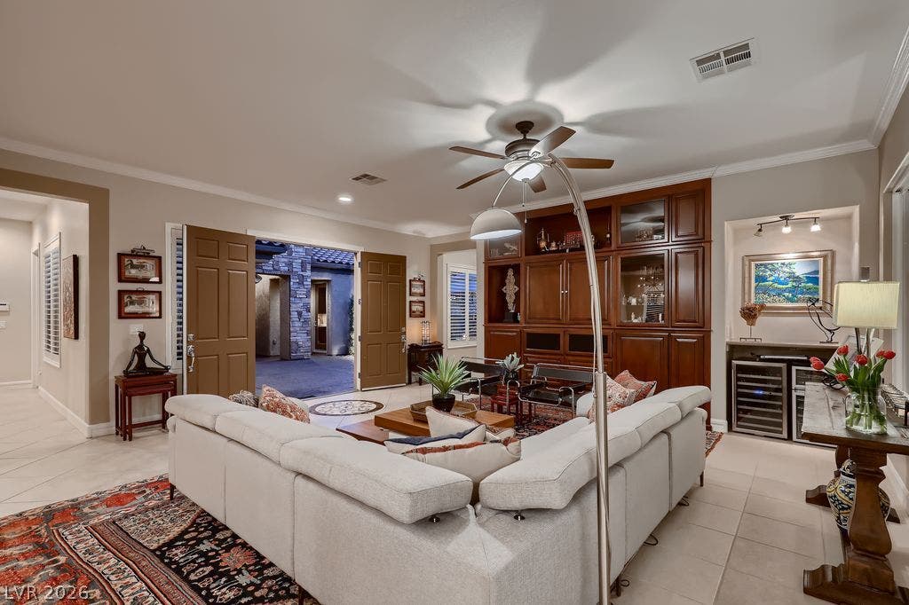 2284 Savannah River Street, Henderson, NV 89044 Double doors open to an inviting living area with a grand built-in media center.