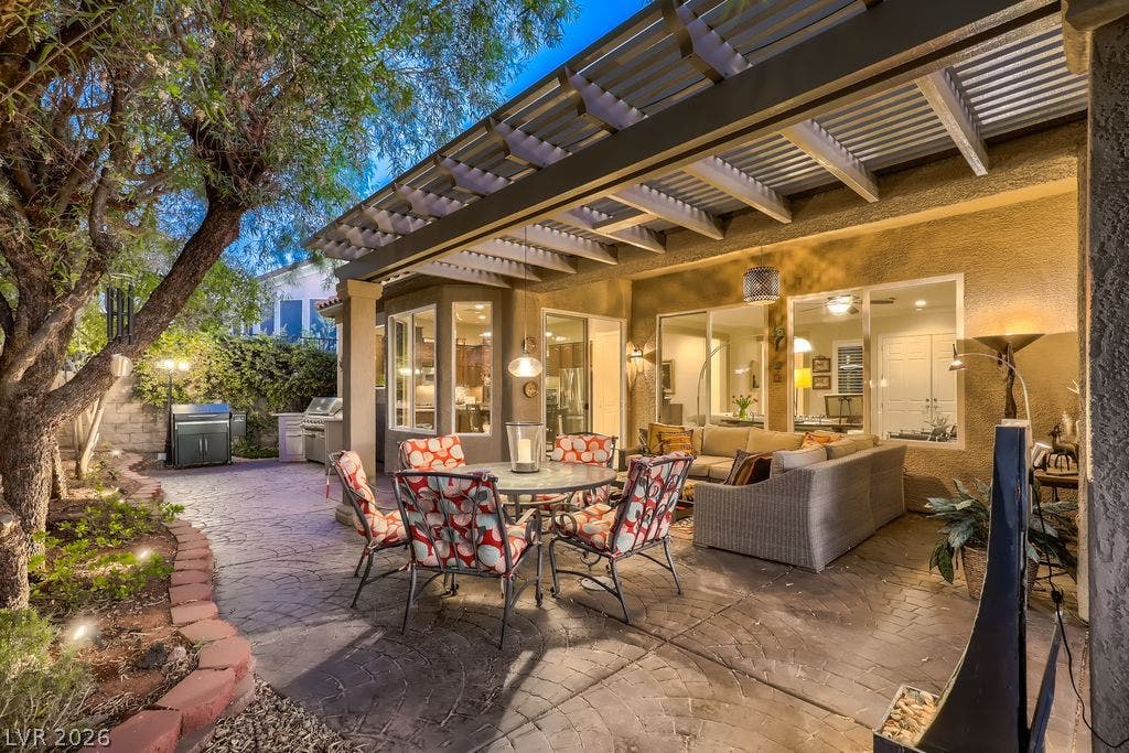 2284 Savannah River Street, Henderson, NV 89044 A spacious stamped concrete patio rests beneath a protective covered pergola structure.