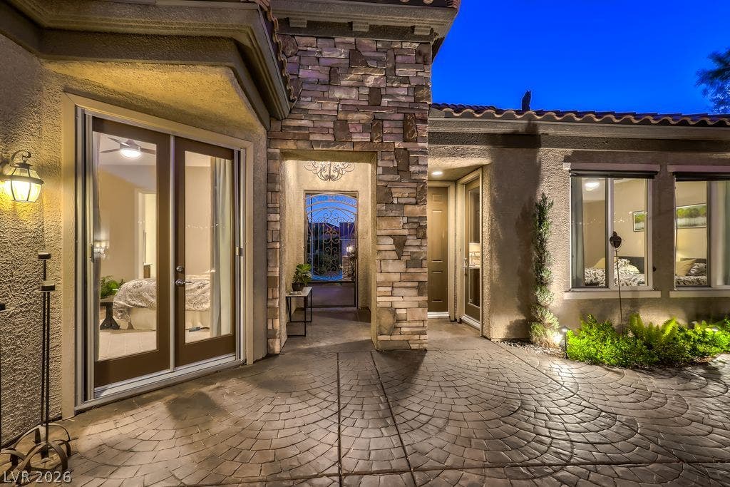 2284 Savannah River Street, Henderson, NV 89044 Textured stone accents and patterned pavers frame a welcoming entry under tile roofing.