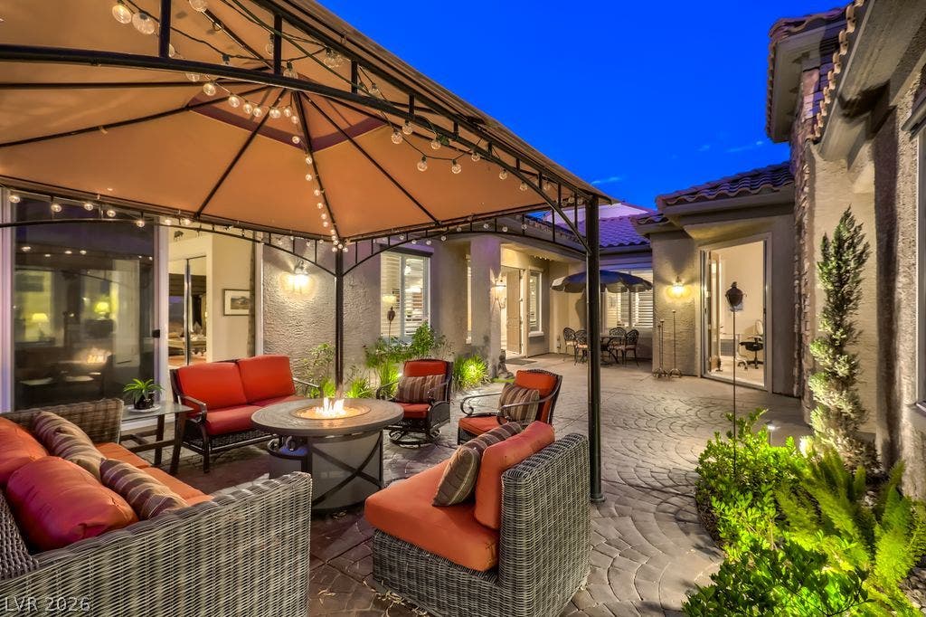 2284 Savannah River Street, Henderson, NV 89044 A spacious courtyard features concrete pavers, stone accents, and a custom tile roof line.