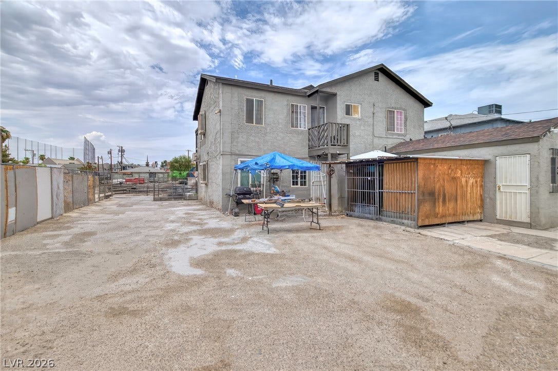 A spacious back lot provides ample room for projects and outdoor utility.