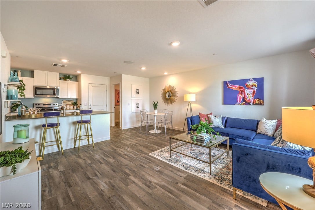 906 Pink Sugarbird Street, Henderson, NV 89011 An open layout connects the living and dining areas with durable wood-look flooring.