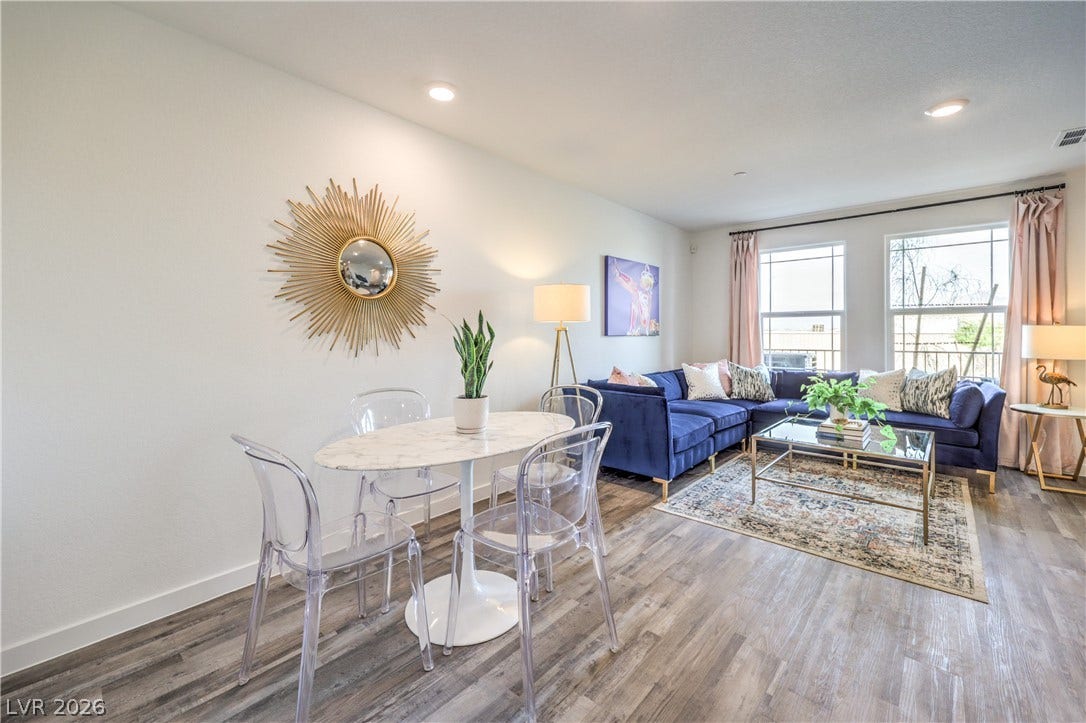 906 Pink Sugarbird Street, Henderson, NV 89011 Smooth wood-look flooring and recessed lighting define this open-concept main level living area.
