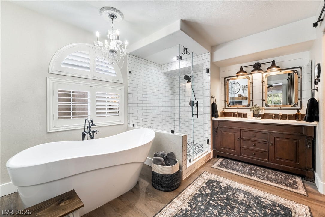 A freestanding tub and a glass-enclosed shower highlight this beautifully crafted master bath.