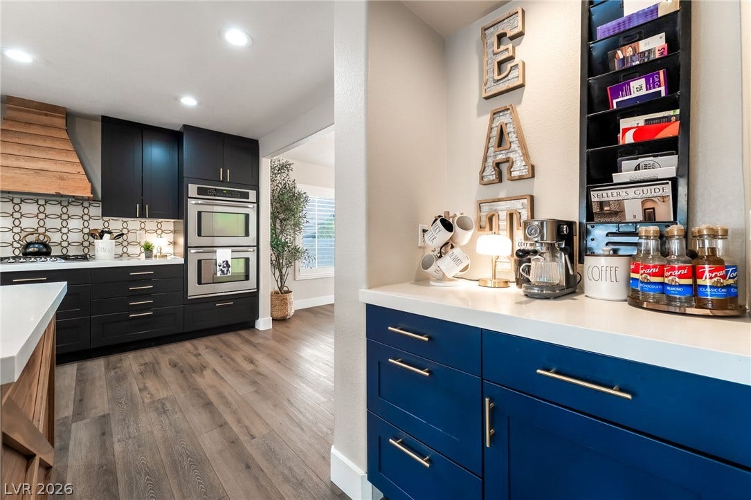 Seamless flow connects a custom beverage station directly to the main culinary workspace.